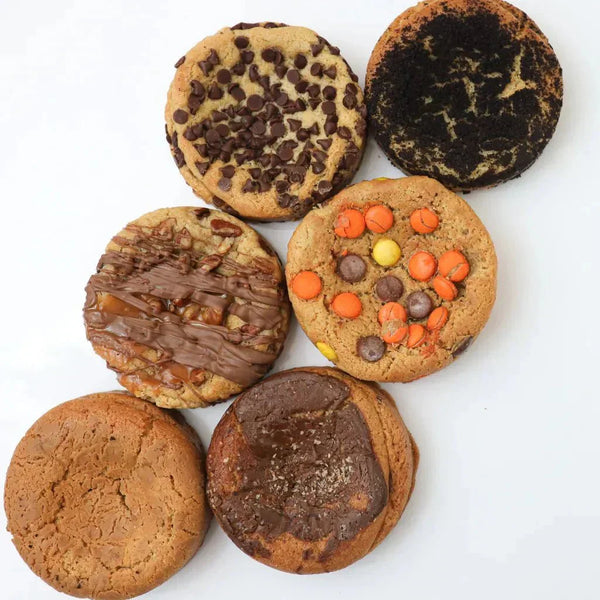 assorted gourmet cookies and butter tarts arranged on a platter for a dessert subscription box