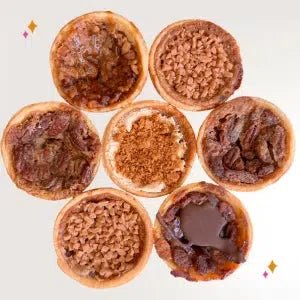 Nine pecan butter tarts arranged in a 3x3 grid on a white background