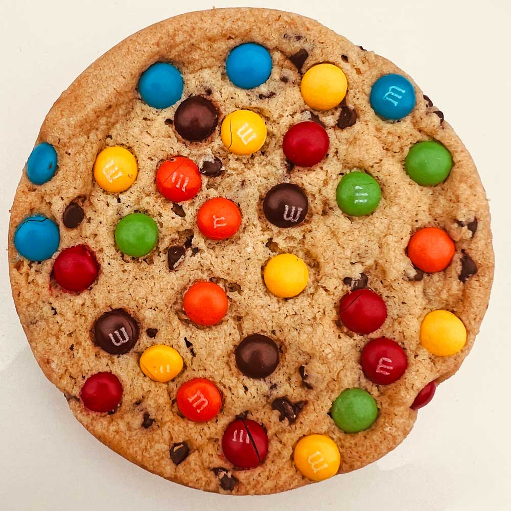 Indulge in 12 handcrafted M&M soft gourmet cookies